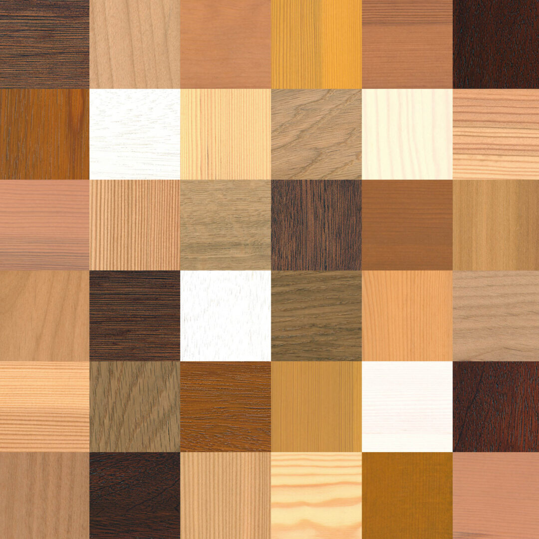 Aufsicht auf eine große Auswahl an verschiedenen Holz- und Dekorarten für die Fertigung eines maßgeschneiderten Esstischs